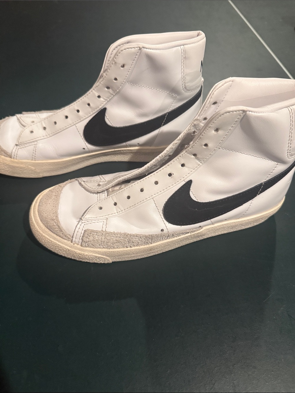 Nike White High-Top Sneakers with Black Swoosh